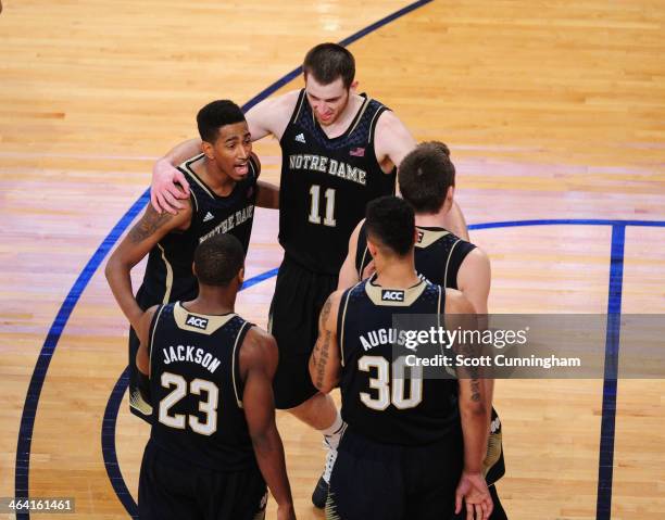 Eric Atkins of the Notre Dame Fighting Irish huddles with teammates during the game against the Georgia Tech Yellow Jackets at McCamish Pavilion on...