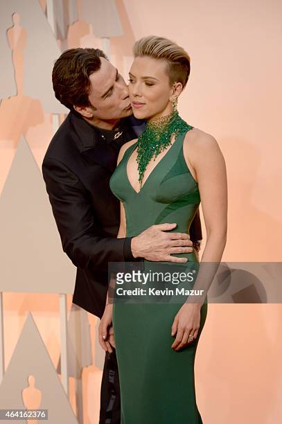 Actor John Travolta and actress Scarlett Johansson attend the 87th Annual Academy Awards at Hollywood & Highland Center on February 22, 2015 in...