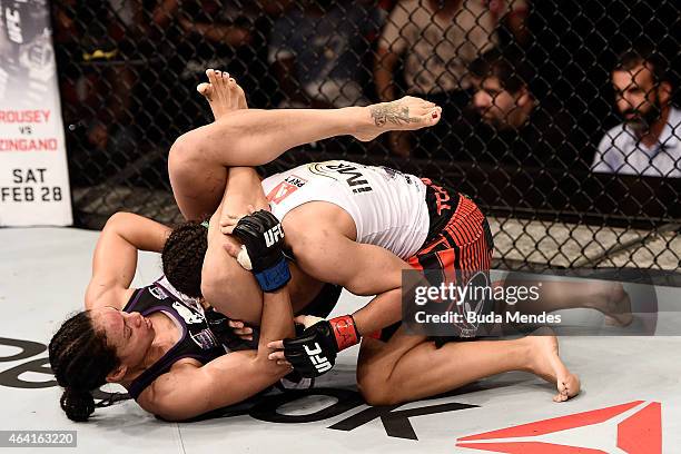 Marion Reneau of United States punches Jessica Andrade of the Brazil in their bantamweight bout during the UFC Fight Night at Gigantinho Gymnasium on...