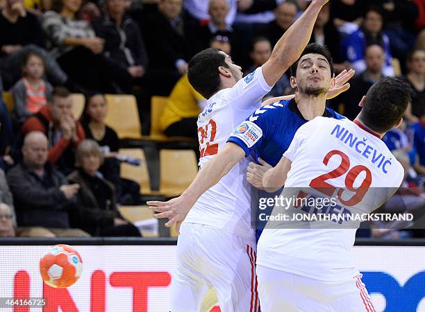 Russia's centre back Inal Aflitulin vies with Croatia's centre back Josip Valcic and left wing Ivan Nincevic during the men's EHF Euro 2014 Handball...