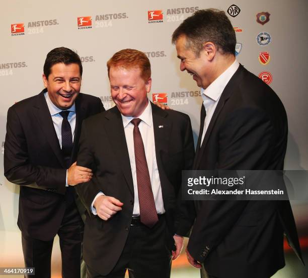 Christian Seifert, CEO of DFL and DFL manager Andreas Rettig joke with Brian Sullivan chairman of SKY Germany during the DFL New Year's Reception at...