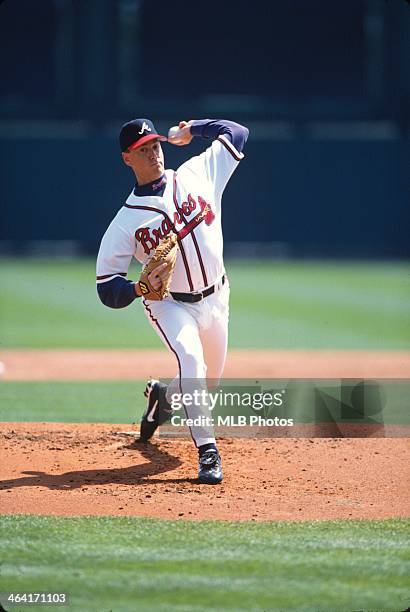 Tom Glavine of the Atlanta Braves pitches in a National League game in an undated and unspecified location.