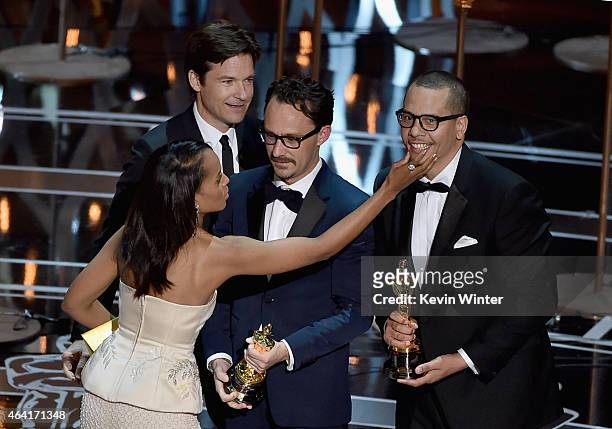 Actress Kerry Washington grabs the face of James Lucas onstage after Lucas and Mat Kirkby win for Best Live Action Short Film for "The Phone Call"...