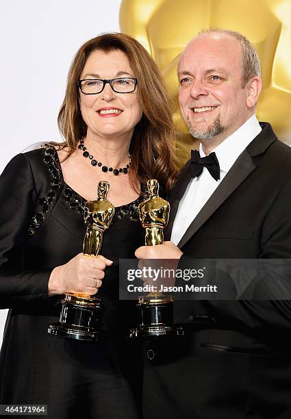 Frances Hannon and Mark Coulier, winners of the Best Makeup & Hairstyling Award for 'The Grand Budapest Hotel' pose in the press room during the 87th...