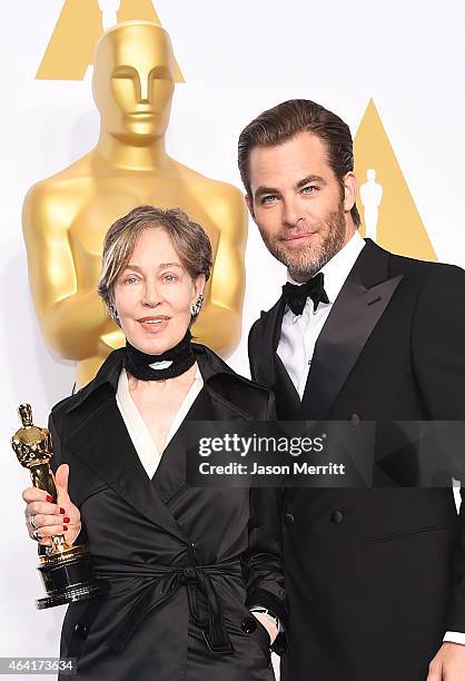 Costume designer Milena Canonero, winner of the Best Costume Design Award for 'The Grand Budapest Hotel' and actor Chris Pine pose in the press room...