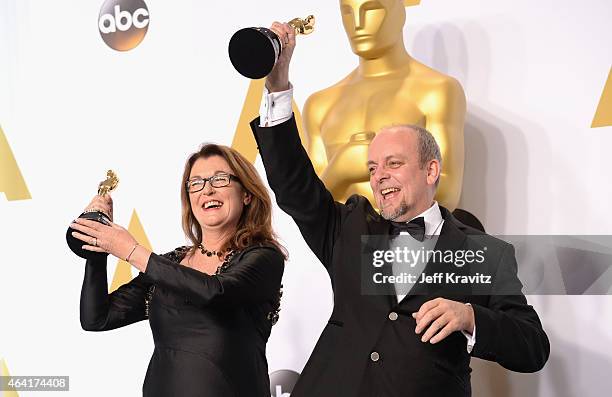 Frances Hannon and Mark Coulier, with the award for best make-up and hairstyling for film "The Grand Budapest Hotel" pose in the press room during...