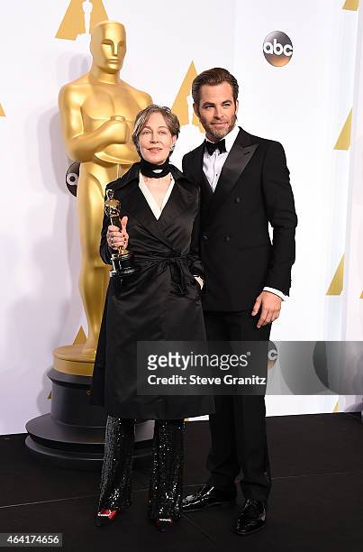 Costume designer Milena Canonero and actor Chris Pine pose in the press room during the 87th Annual Academy Awards at Loews Hollywood Hotel on...