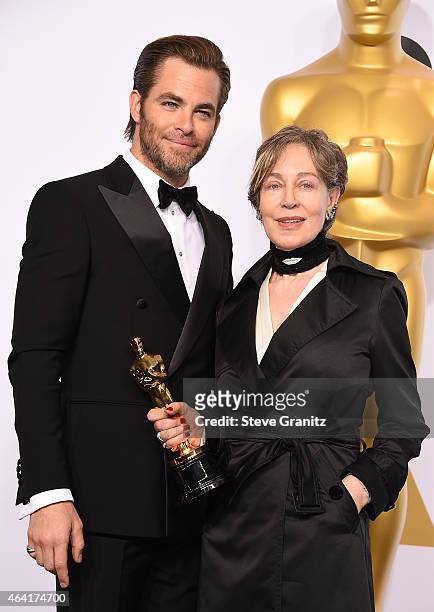 Costume designer Milena Canonero and actor Chris Pine pose in the press room during the 87th Annual Academy Awards at Loews Hollywood Hotel on...