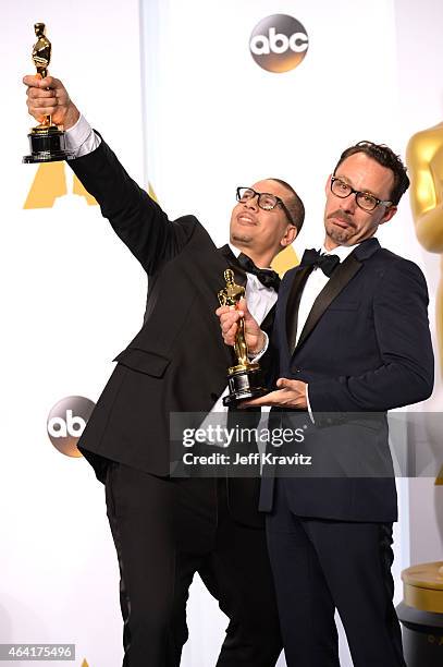 James Lucas and Mat Kirby, with the award for best live action short film for "The Phone Call", pose in the press room during the 87th Annual Academy...