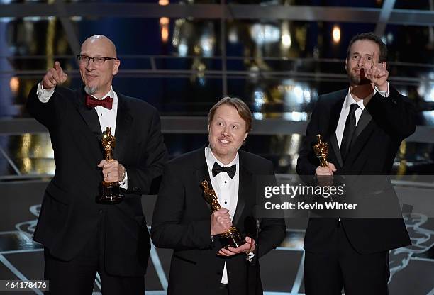 Director Don Hall accepts the Best Animated Feature Award for "Big Hero 6" with Chris Williams and Roy Conli onstage during the 87th Annual Academy...