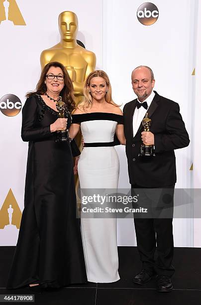 Makeup artists Frances Hannon and Mark Coulier pose with actress Reese Witherspoon in the press room during the 87th Annual Academy Awards at Loews...