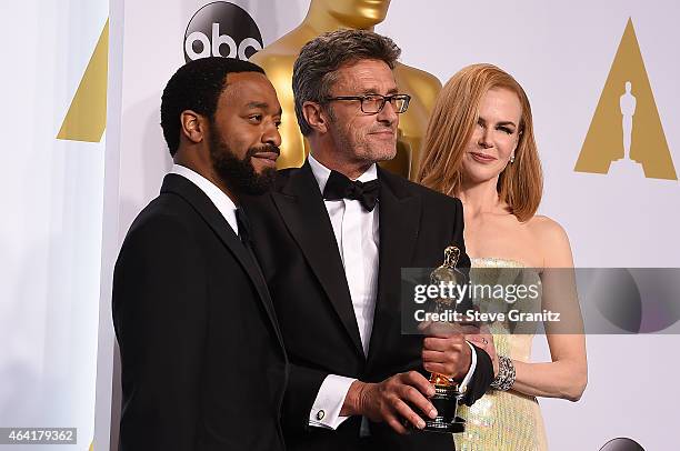 Actor Chiwetel Ejiofor, filmmaker Pawel Pawlikowski and actress Nicole Kidman pose in the press room during the 87th Annual Academy Awards at Loews...