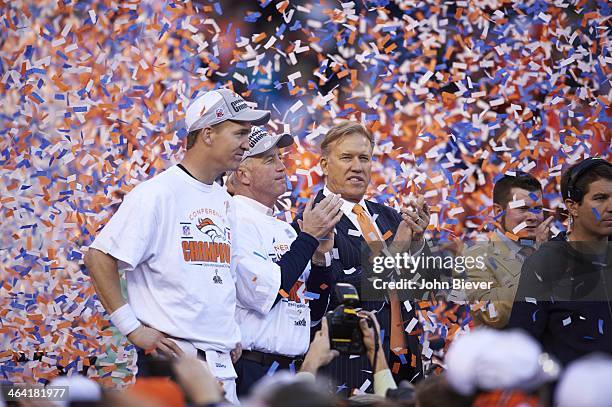 Playoffs: Denver Broncos QB Peyton Manning , coach John Fox and executive vice president of football operations John Elway on stage during trophy...