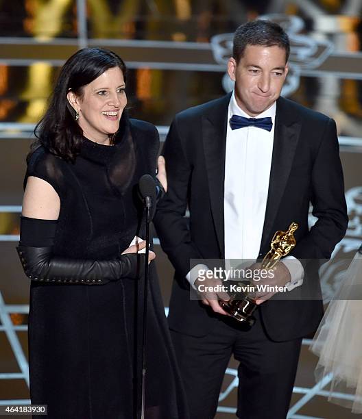 Director Laura Poitras and journalist Glenn Greenwald accept Best Documentary Feature Award for "Citizenfour" onstage during the 87th Annual Academy...