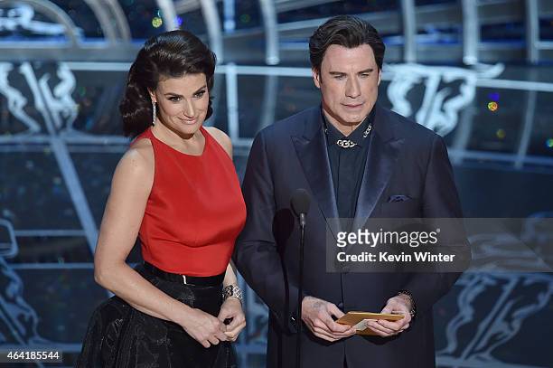 Actress Idina Menzel and actor John Travolta speak onstage during the 87th Annual Academy Awards at Dolby Theatre on February 22, 2015 in Hollywood,...