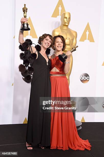 Producers Dana Perry and Ellen Goosenberg Kent pose with their award in the press room during the 87th Annual Academy Awards at Loews Hollywood Hotel...