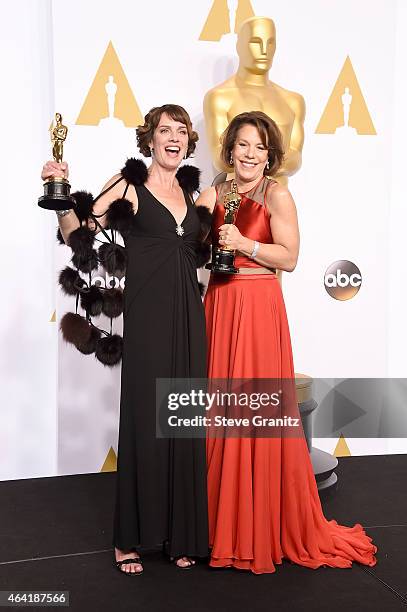 Producers Dana Perry and Ellen Goosenberg Kent pose with their award in the press room during the 87th Annual Academy Awards at Loews Hollywood Hotel...