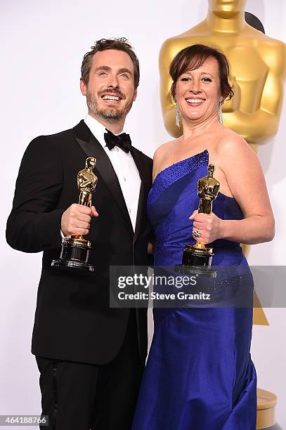 Patrick Osborne and Kristina Reed pose with their award in the press room during the 87th Annual Academy Awards at Loews Hollywood Hotel on February...