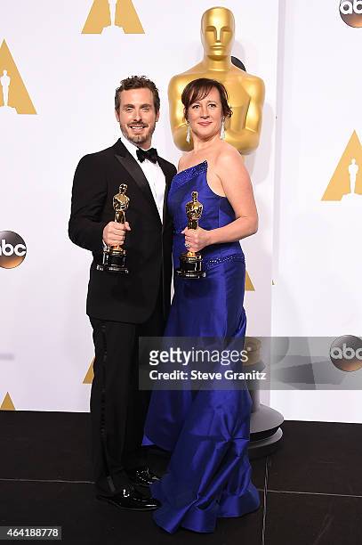 Patrick Osborne and Kristina Reed pose with their award in the press room during the 87th Annual Academy Awards at Loews Hollywood Hotel on February...