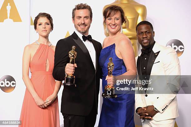 Actress Anna Kendrick, Patrick Osborne and Kristina Reed, with the award for best animated short film for "Feast", and comedian/actor Kevin Hart pose...