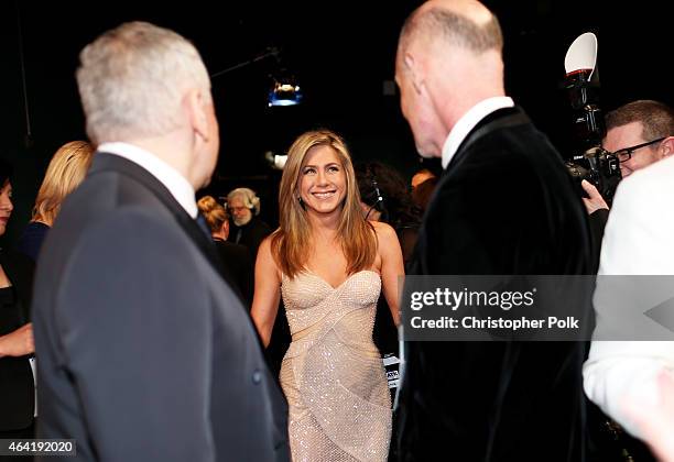 Oscar Producers Craig Zadan and Neil Meron with actress Jennifer Aniston backstage during the 87th Annual Academy Awards at Dolby Theatre on February...