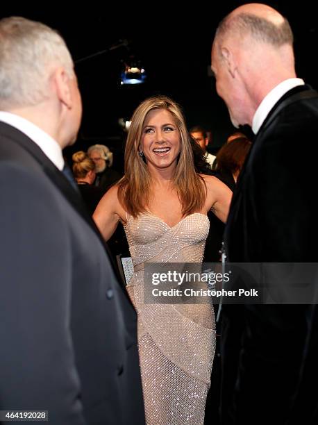 Oscar Producers Craig Zadan and Neil Meron with actress Jennifer Aniston backstage during the 87th Annual Academy Awards at Dolby Theatre on February...