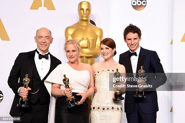 Actors J.K. Simmons, Patricia Arquette, Julianne Moore and Eddie Redmayne pose with their awards in the press room during the 87th Annual Academy...