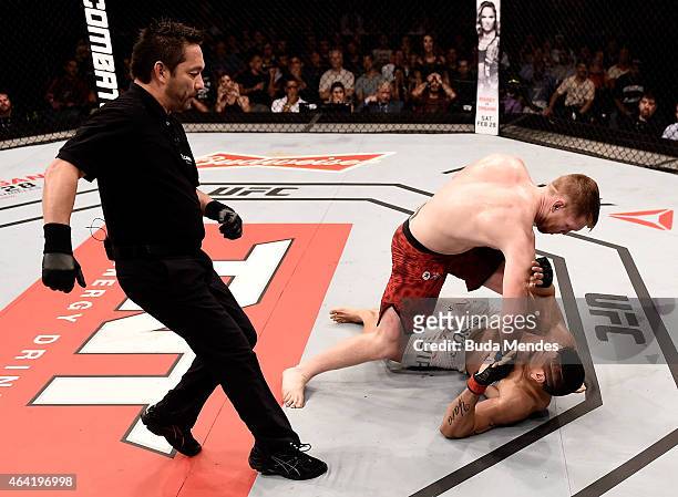 Sam Alvey of the United States punches Cezar Ferreira of Brazil in their middleweight bout during the UFC Fight Night at Gigantinho Gymnasium on...