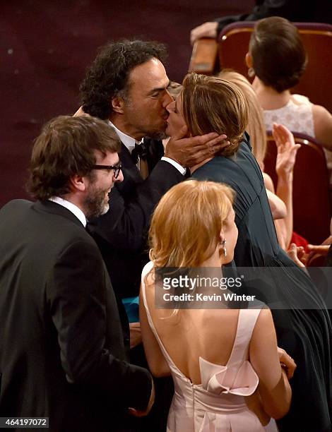 Screenwriter Nicolas Giacobone, director Alejandro Gonzalez Inarritu with Maria Eladia Hagerman accept the Best Picture award for 'Birdman' onstage...