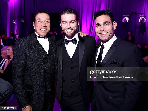 Singer/songwriter Smokey Robinson, actor Chace Crawford, and manager Eric Podwall attend the 23rd Annual Elton John AIDS Foundation Academy Awards...