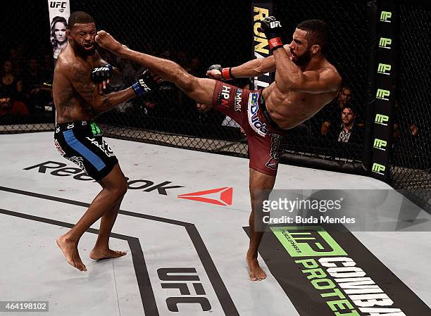 Edson Barboza of Brazil kicks Michael Johnson of the United States in their lightweight bout during the UFC Fight Night at Gigantinho Gymnasium on...