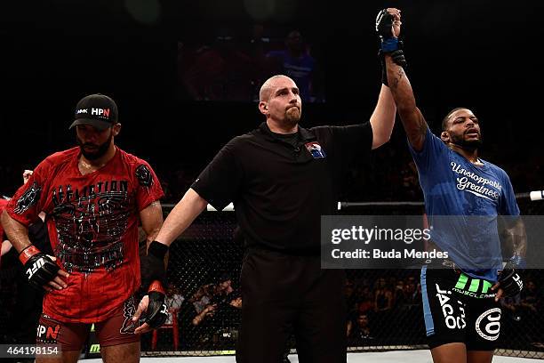 Michael Johnson of the United States celebrates after defeating Edson Barboza of Brazil in their lightweight bout during the UFC Fight Night at...