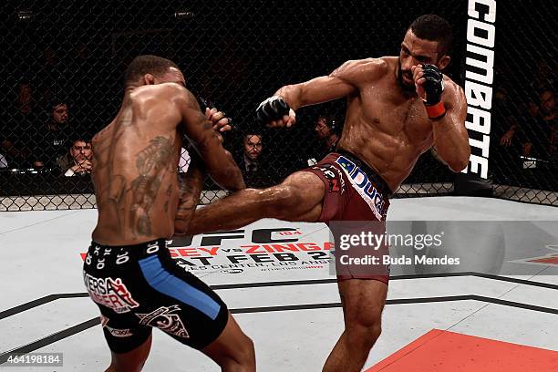 Edson Barboza of Brazil kicks Michael Johnson of the United States in their lightweight bout during the UFC Fight Night at Gigantinho Gymnasium on...