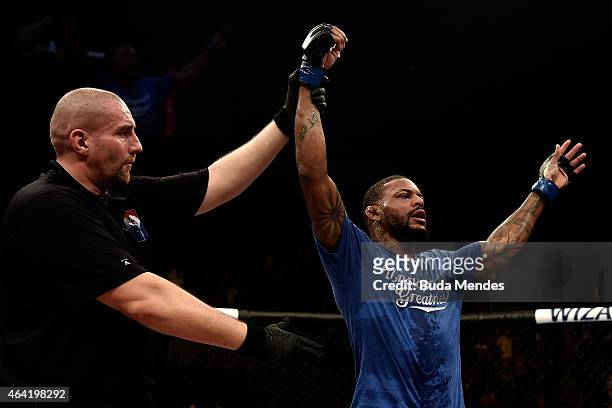 Michael Johnson of the United States celebrates after defeating Edson Barboza of Brazil in their lightweight bout during the UFC Fight Night at...