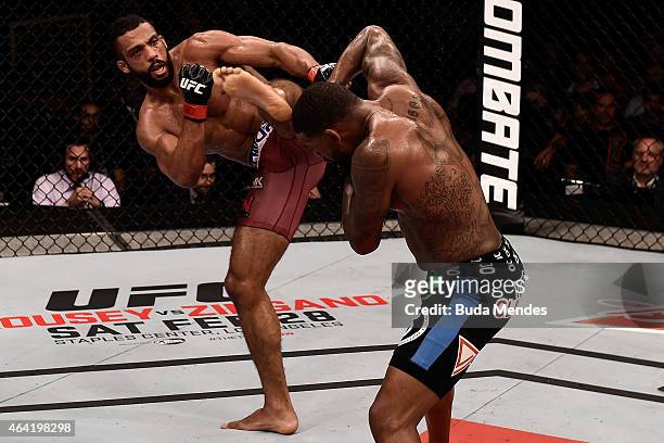 Edson Barboza of Brazil kicks Michael Johnson of the United States in their lightweight bout during the UFC Fight Night at Gigantinho Gymnasium on...