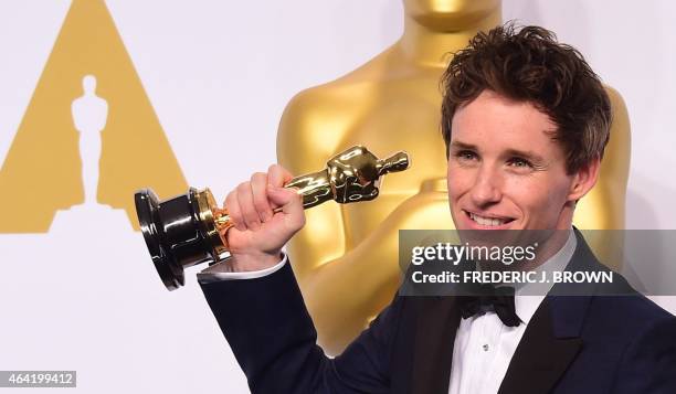 Actor Eddie Redmayne, winner of the Best Actor in a Leading Role Award for "The Theory of Everything" poses in the press room during the 87th Oscars...