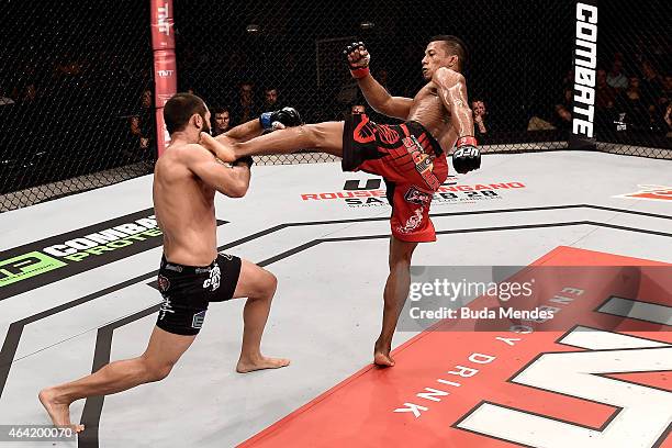 Iuri Alcantara of Brazil kicks Frankie Saenz of the United States in their bantamweight bout during the UFC Fight Night at Gigantinho Gymnasium on...