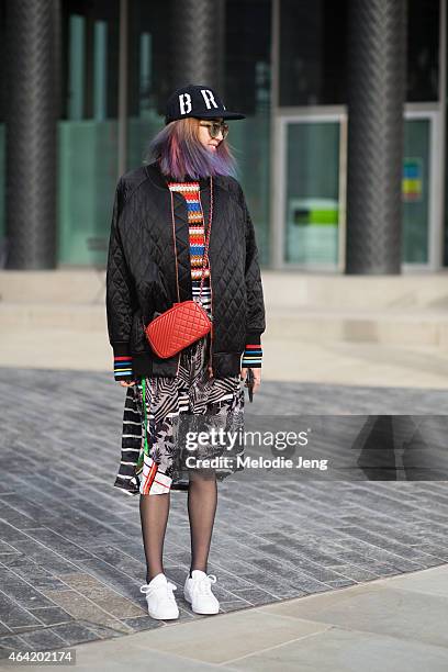 Model Irene Kim wears a Bratson clothing company hat, Preen by Thornton Bregazzi outfit and Lucky Chouette during London Fashion Week Fall/Winter...