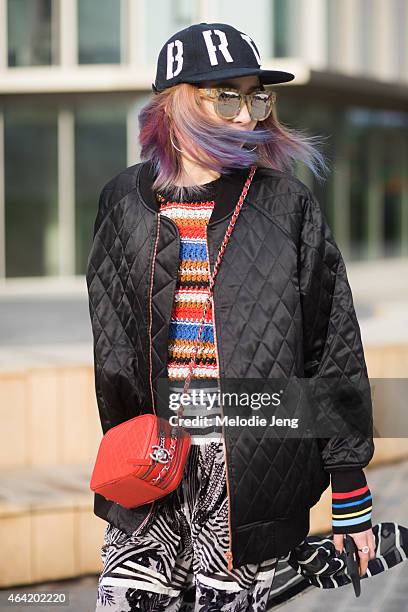 Model Irene Kim wears a Bratson clothing company hat, Preen by Thornton Bregazzi outfit and Lucky Chouette during London Fashion Week Fall/Winter...