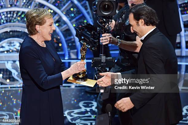 Julie Andrews talks with Alexandre Desplat as he accepts the Best Achievement in Music Written for Motion Pictures, Original Score "The Grand...