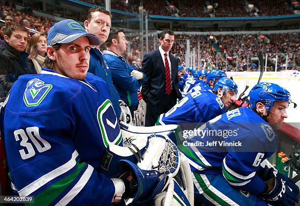 Joacim Eriksson of the Vancouver Canucks looks on from the bench during their NHL game against the St. Louis Blues at Rogers Arena January 10, 2014...