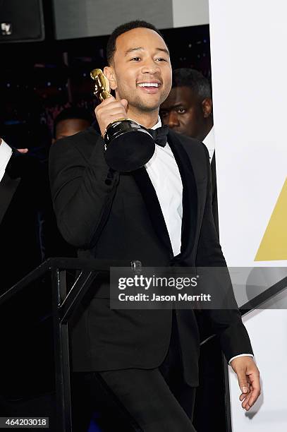 John Legend winners of the Best Original Song Award for 'Glory' from 'Selma' poses in the press room during the 87th Annual Academy Awards at Loews...