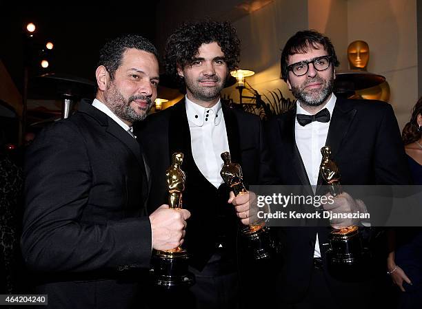 Writers Alexander Dinelaris, Armando Bo, and Nicolas Giacobone, winners of Best Original Screenplay for 'Birdman' attend the 87th Annual Academy...