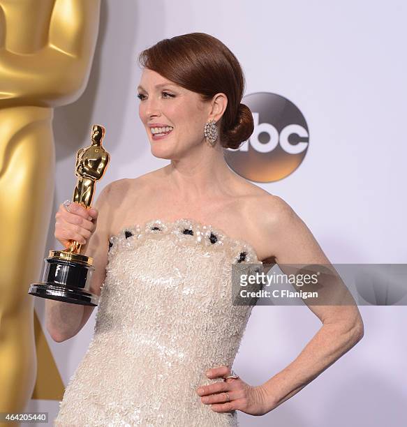 Actress Julianne Moore poses in the press room as the winner of the 'Best Actress in a Leading Role' category during the 87th Annual Academy Awards...