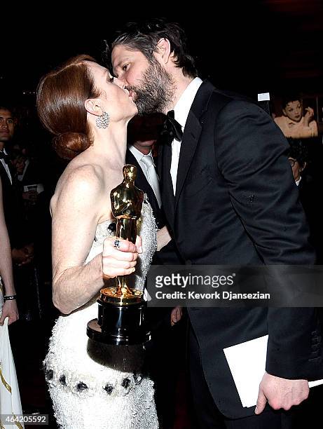Actress Julianne Moore, winner of Best Actress in a Leading Role Award for 'Still Alice,' and Bart Freundlich attend the 87th Annual Academy Awards...