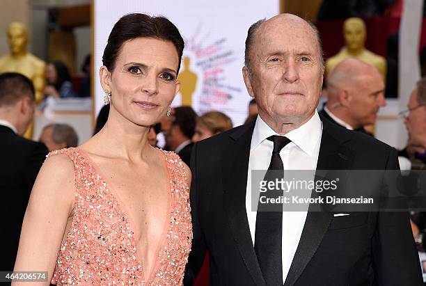 Luciana Pedraza and actor Robert Duvall attends the 87th Annual Academy Awards at Hollywood & Highland Center on February 22, 2015 in Hollywood,...