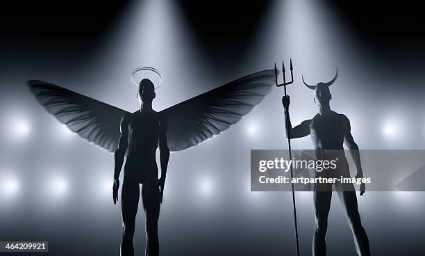 angel and devil standing next to each other - honesty stock pictures, royalty-free photos & images