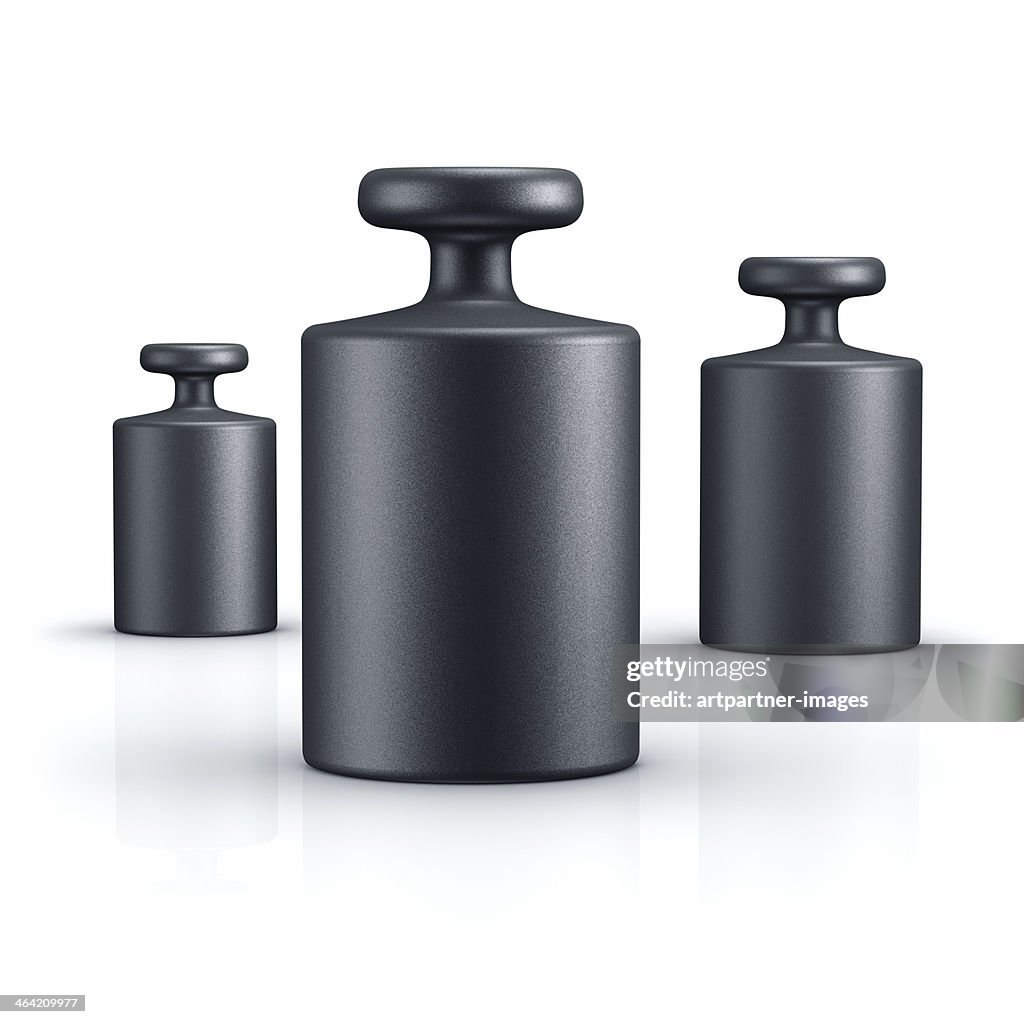 Black weights of different size on white