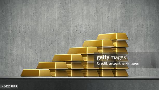 a growing stack of gold bars - gold bars stock pictures, royalty-free photos & images