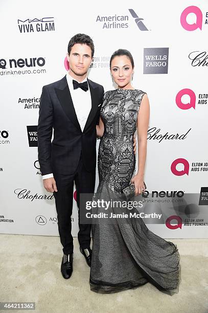 Actors Robbie Amell and Italia Ricci attend the 23rd Annual Elton John AIDS Foundation Academy Awards Viewing Party on February 22, 2015 in Los...